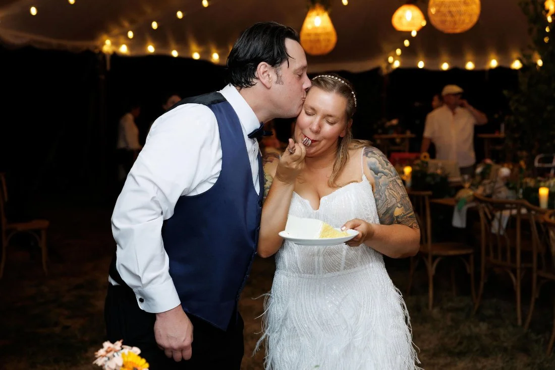 Newlyweds share a sweet kiss during their outdoor wedding in New York