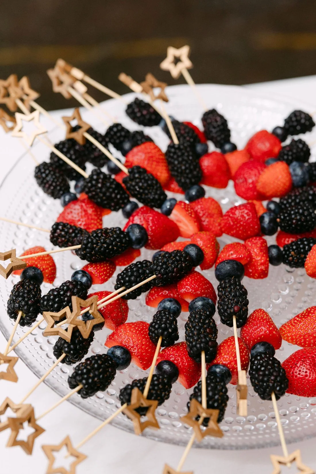 Guests enjoying appetizers served during cocktail hour at an outdoor wedding in New York