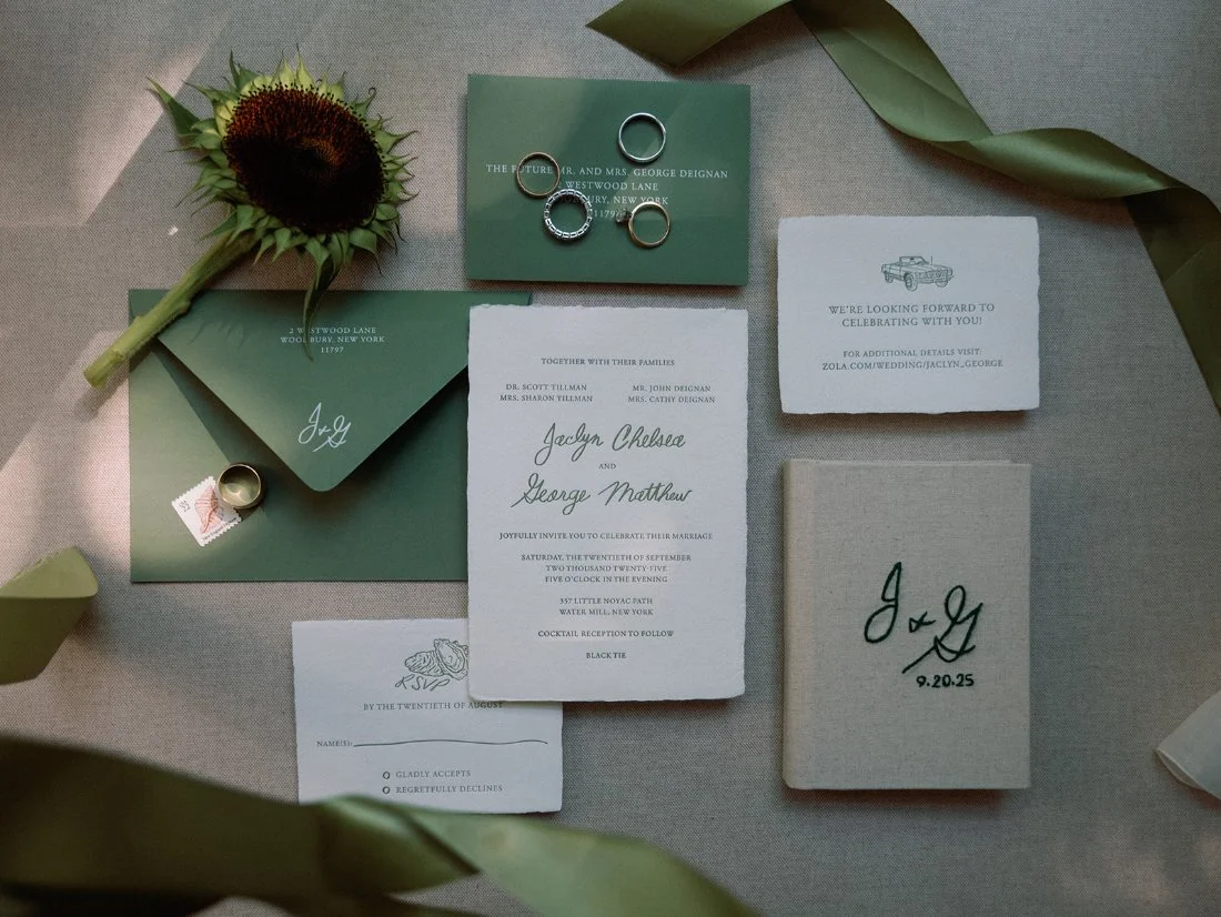 Flat lay of invitations and wedding details for an elegant Hamptons wedding in Water Mill.