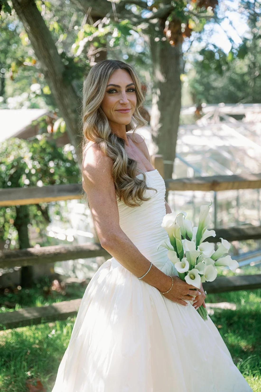 Close-up of the bride outdoors with soft Hamptons wedding light surrounding her.