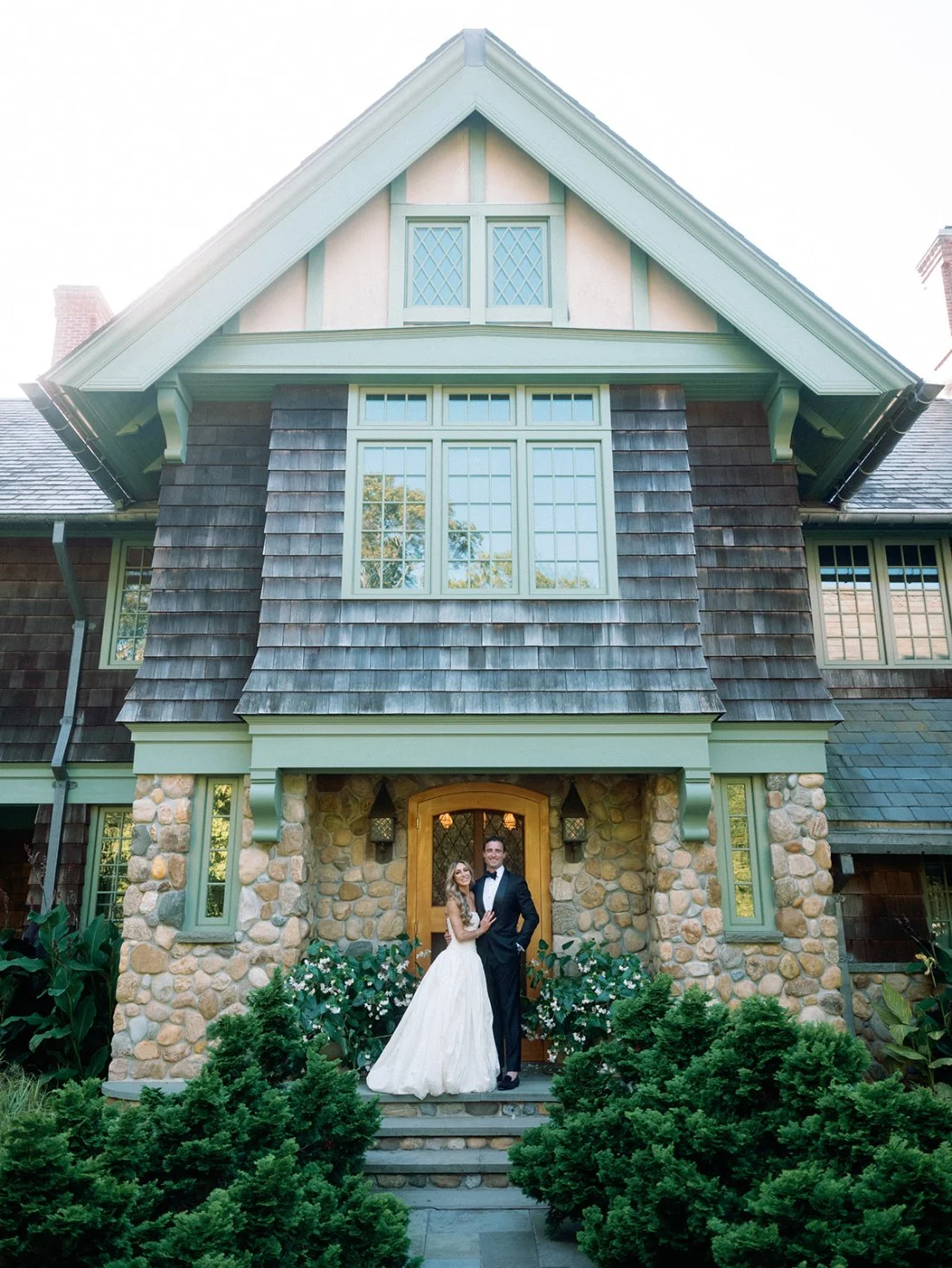 Bride and groom outside their private Water Mill estate during their Hamptons wedding.