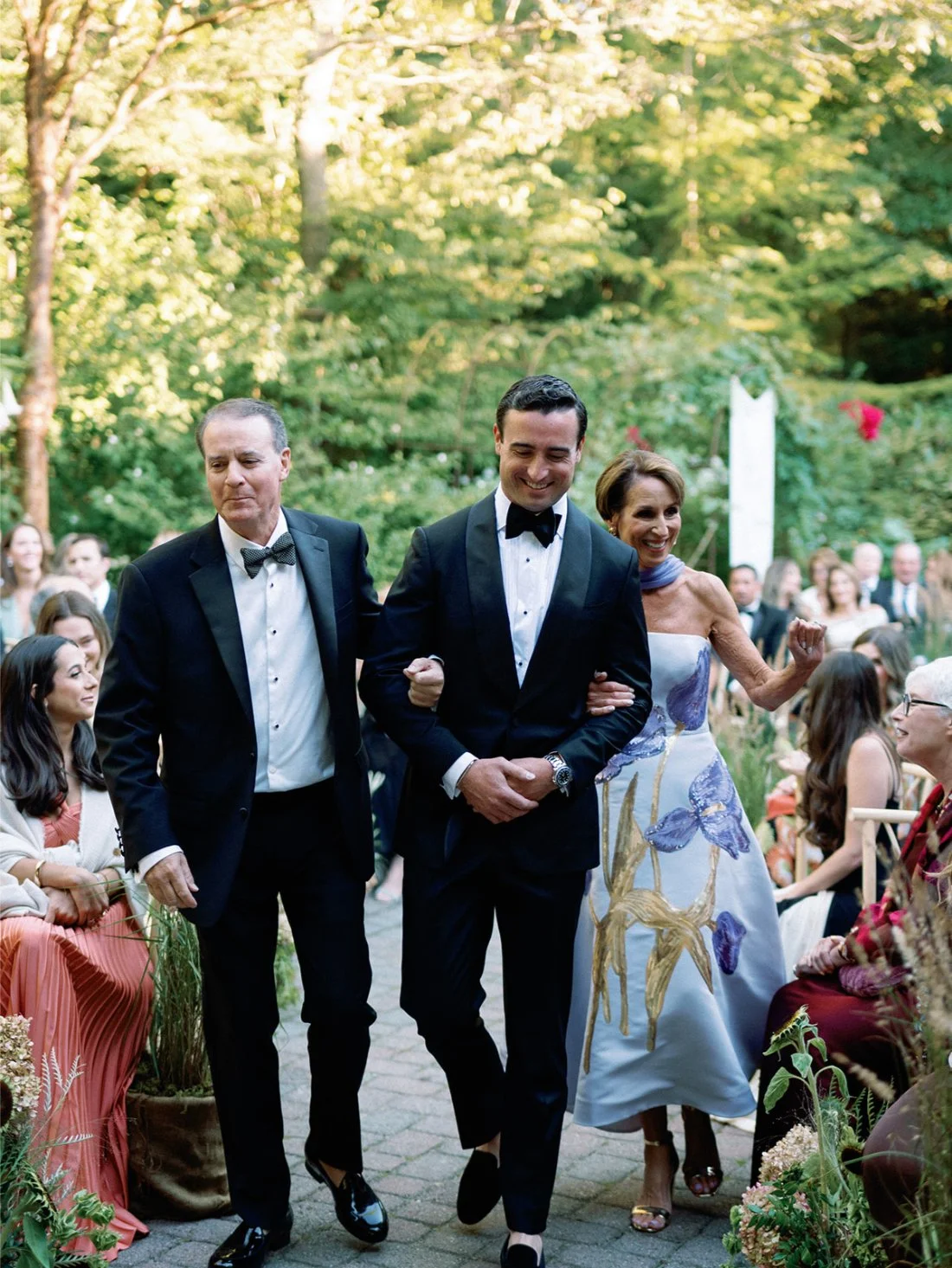 Groom walking down the aisle during the Hamptons wedding ceremony.