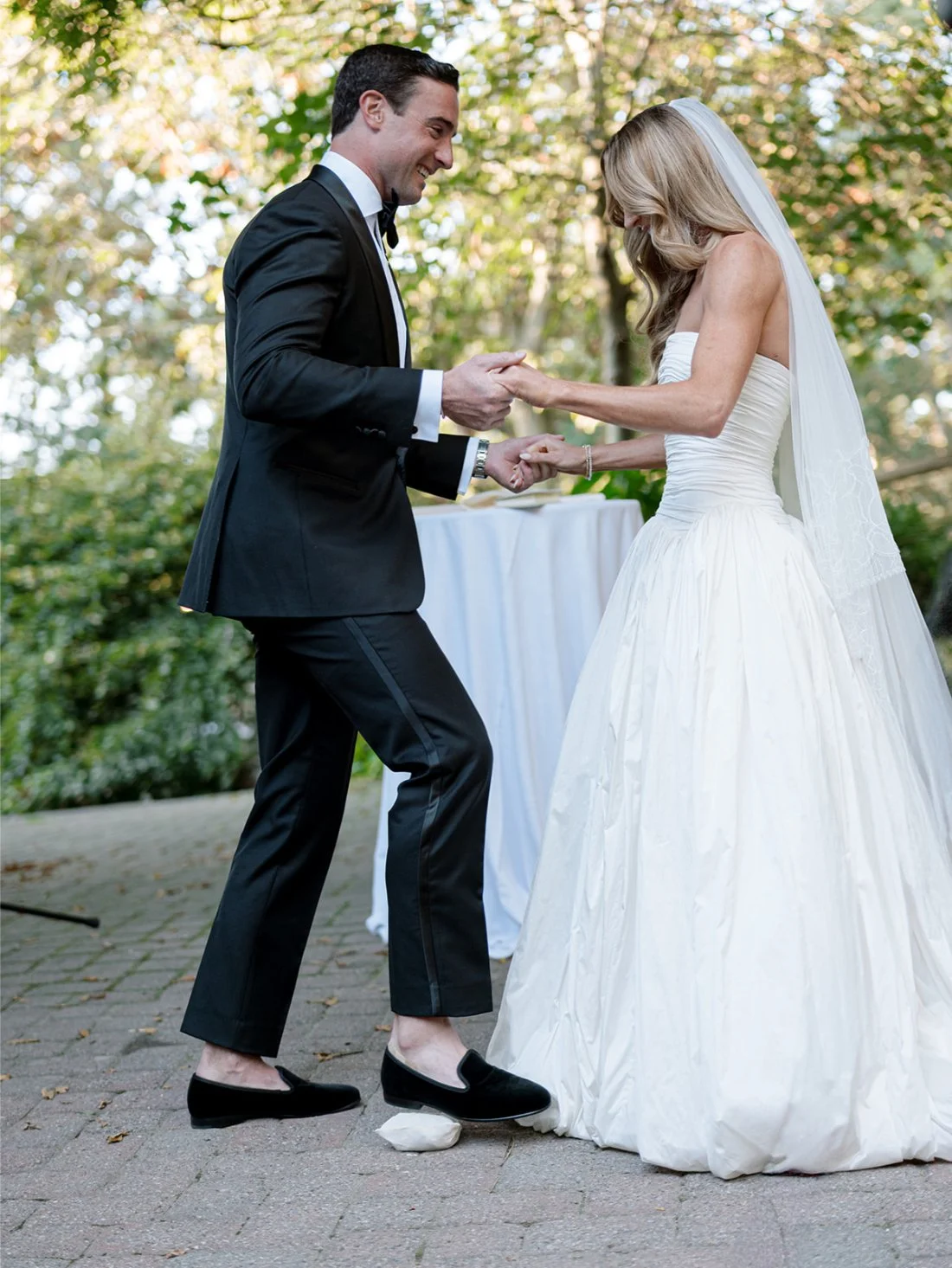 Groom stomping on the glass during the Jewish Hamptons wedding ceremony.