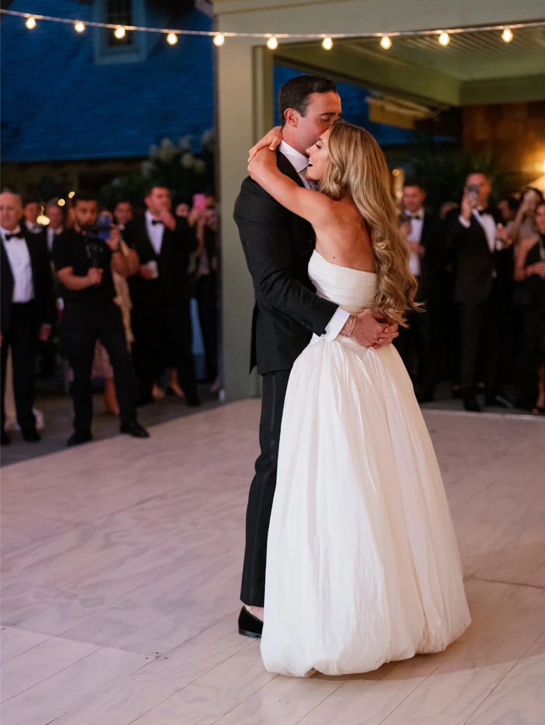Bride and groom dancing together on the outdoor dance floor at their Hamptons wedding.