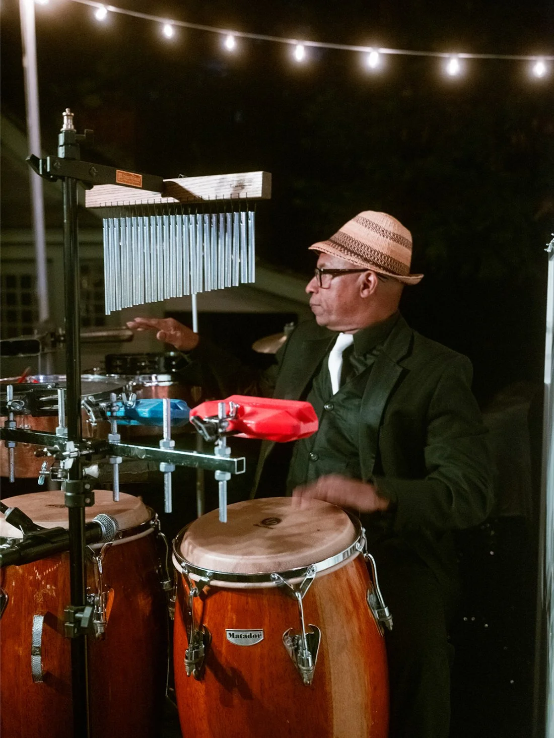 Live band with drums performing during the evening celebration at a Hamptons wedding.