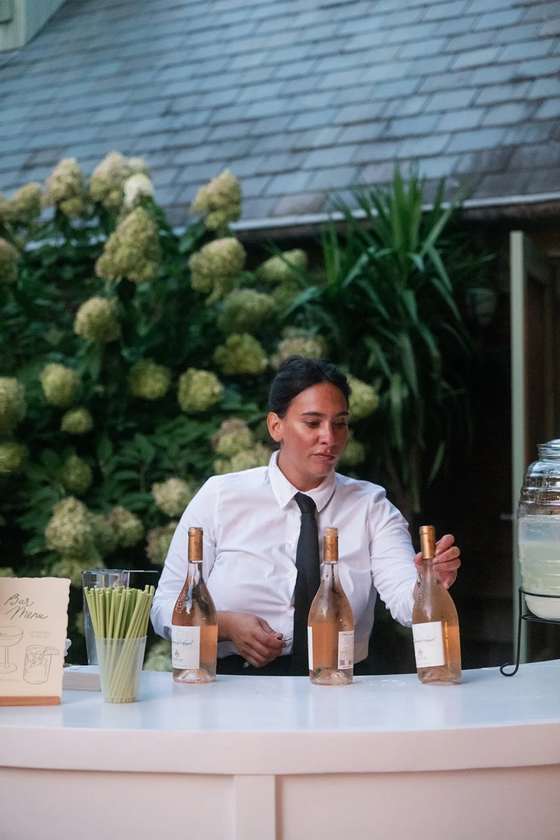 bar tender making drinks for cocktail hour 