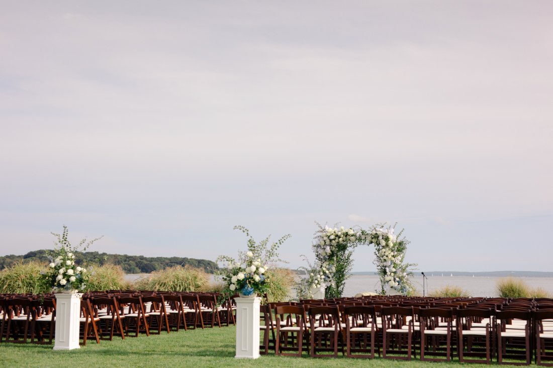 Outdoor wedding ceremony overlooking the water at Peconic Bay Yacht Club in Southold New York