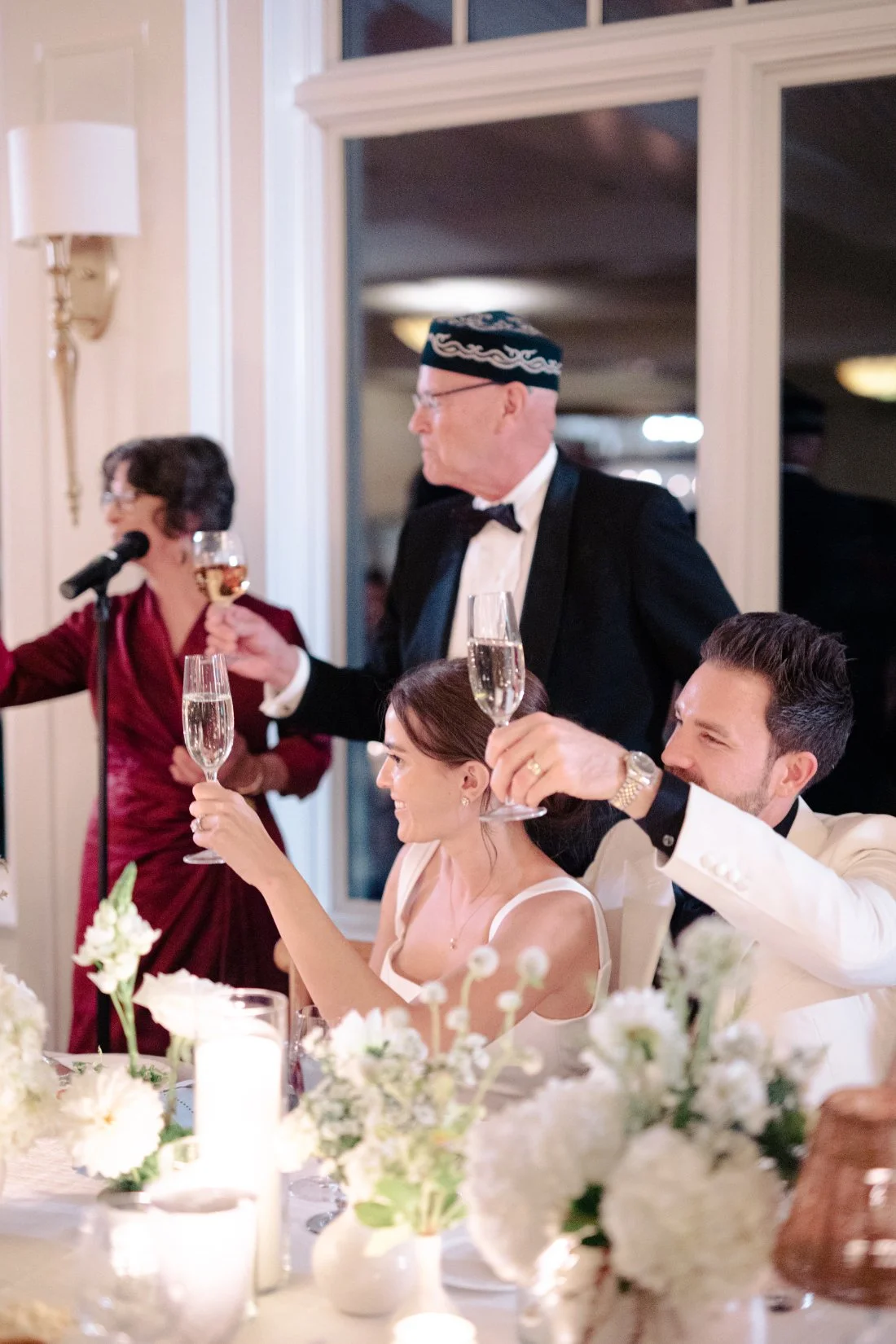 Bride and groom toasting with champagne during reception at Peconic Bay Yacht Club