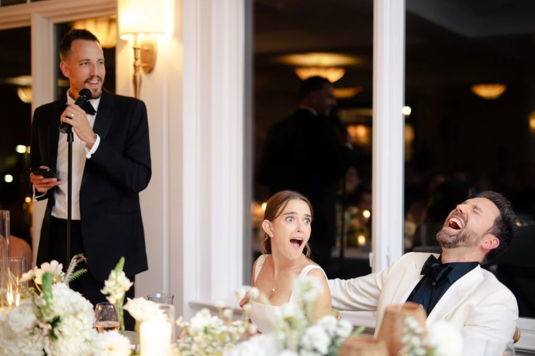 Candid reaction from bride and groom during speech at Peconic Bay Yacht Club wedding