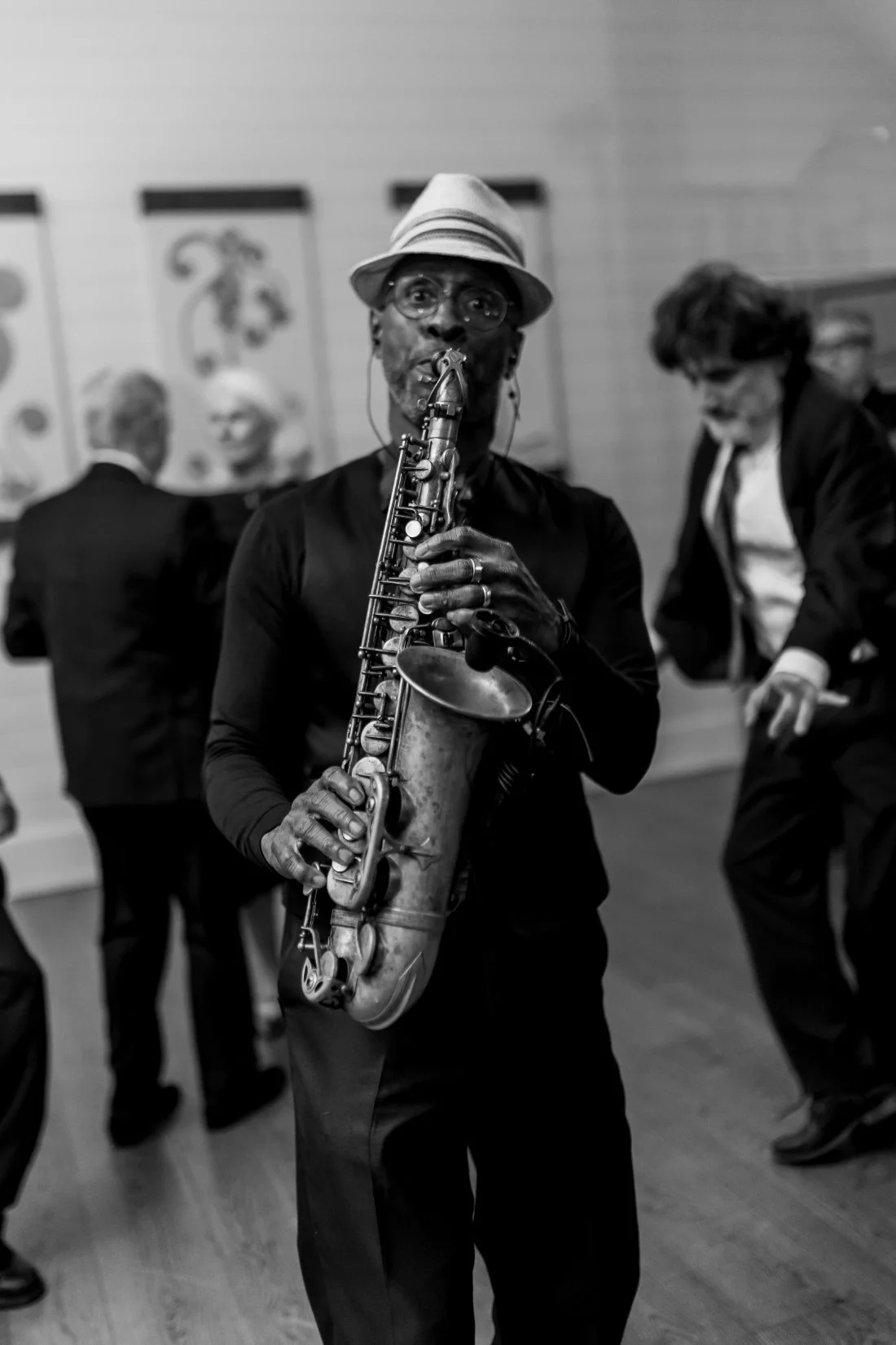 Saxophone player performing on dance floor during Peconic Bay Yacht Club wedding