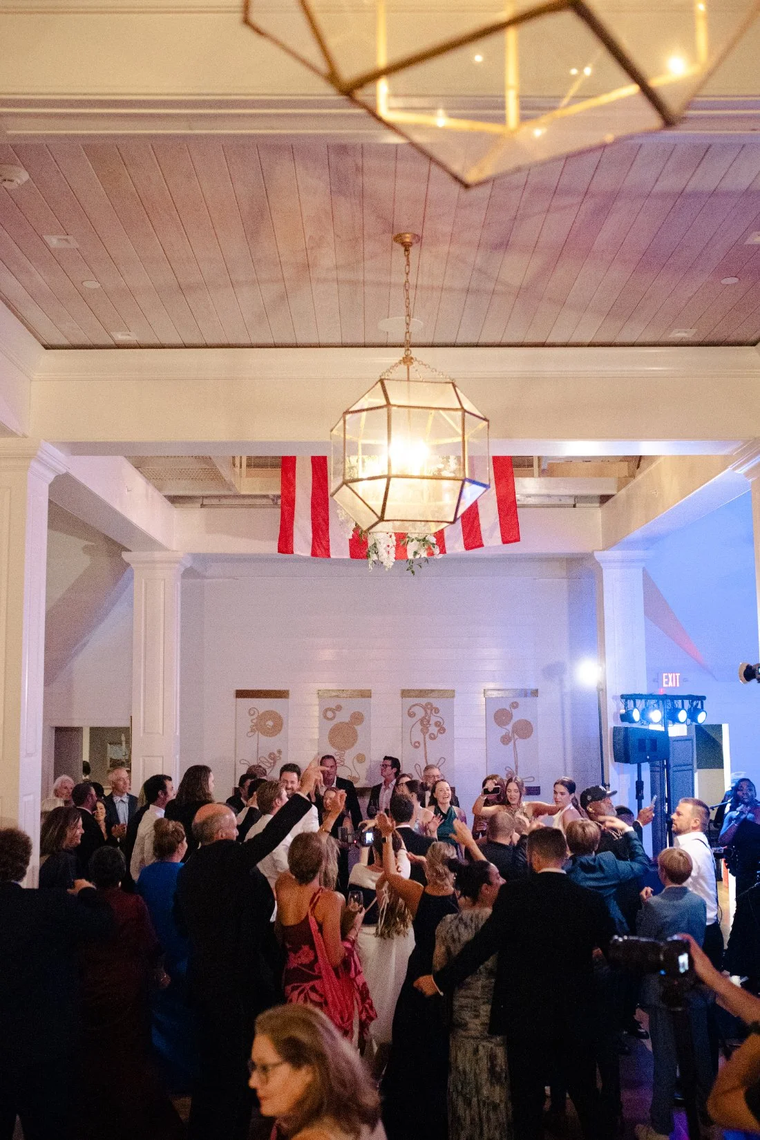 Packed dance floor with guests dancing at Peconic Bay Yacht Club wedding reception