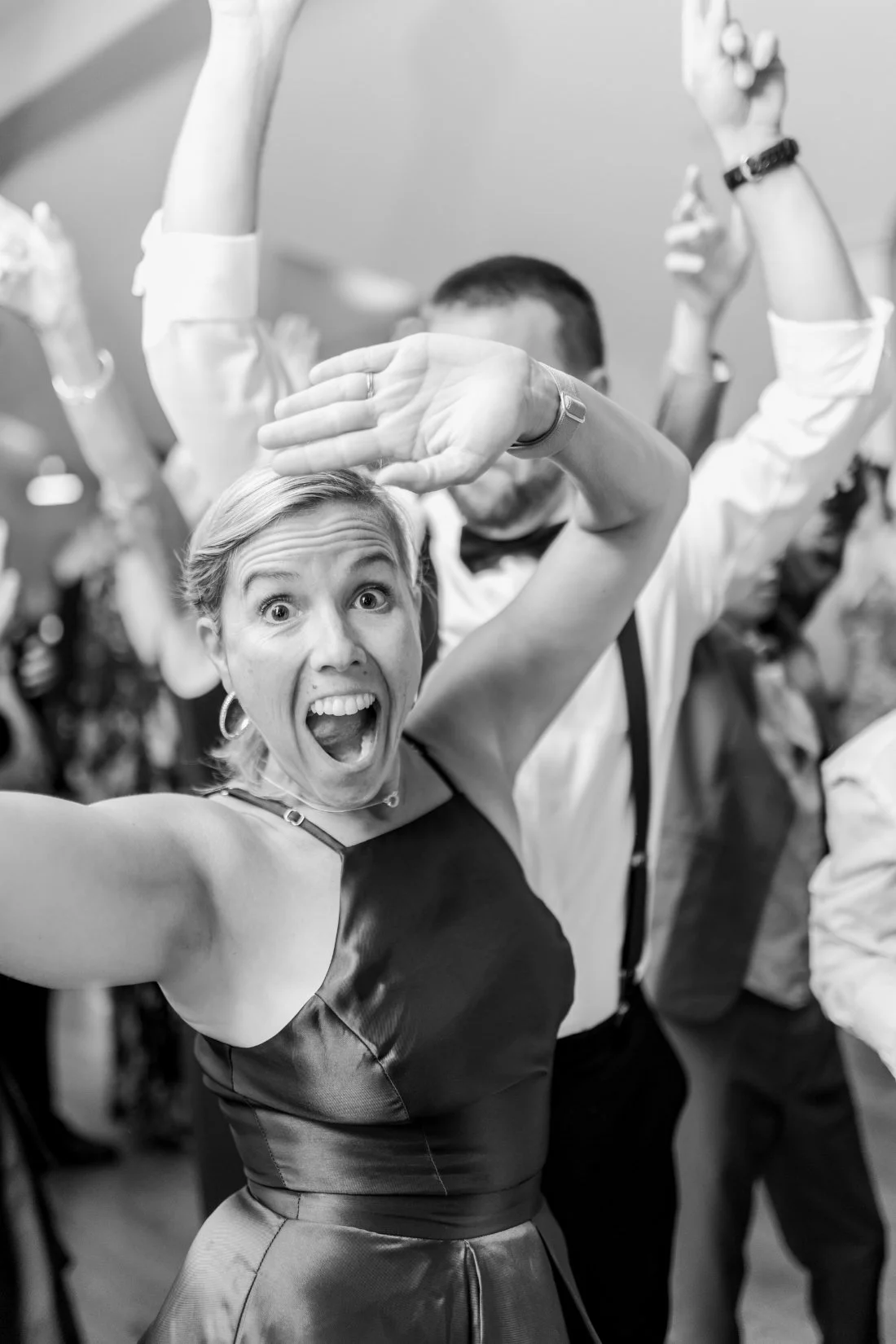 Wedding guests dancing together on the dance floor at Peconic Bay Yacht Club