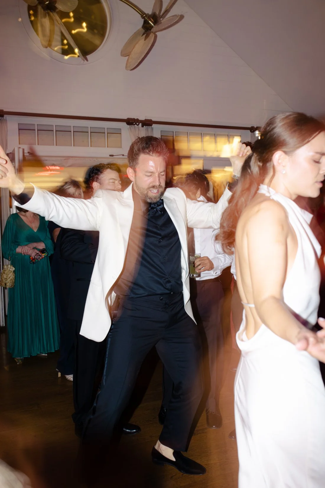 Guests celebrating and dancing during reception at Peconic Bay Yacht Club
