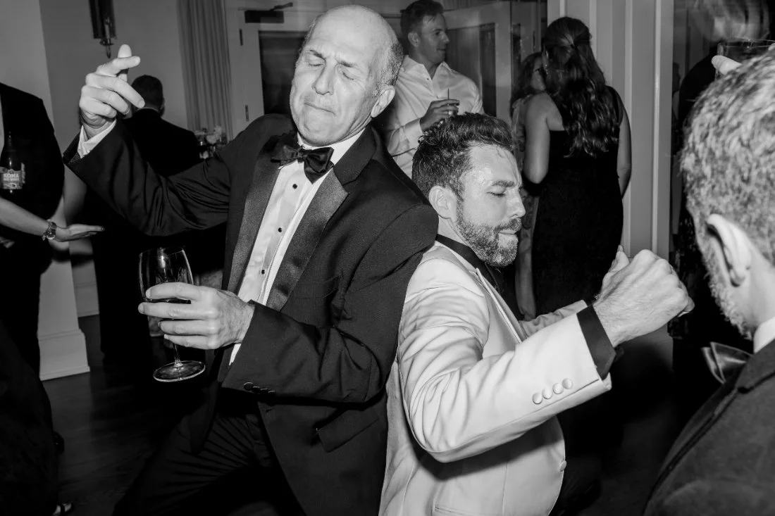 Guests dancing under warm lighting at Peconic Bay Yacht Club reception