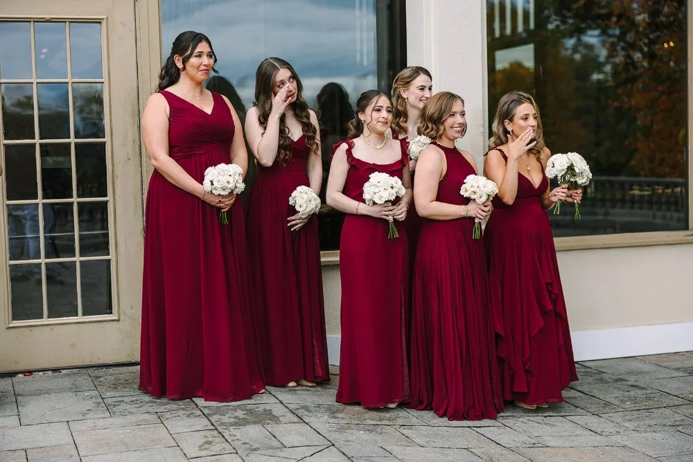 Bridesmaids reacting emotionally during first look at a Tarrytown House Estate wedding