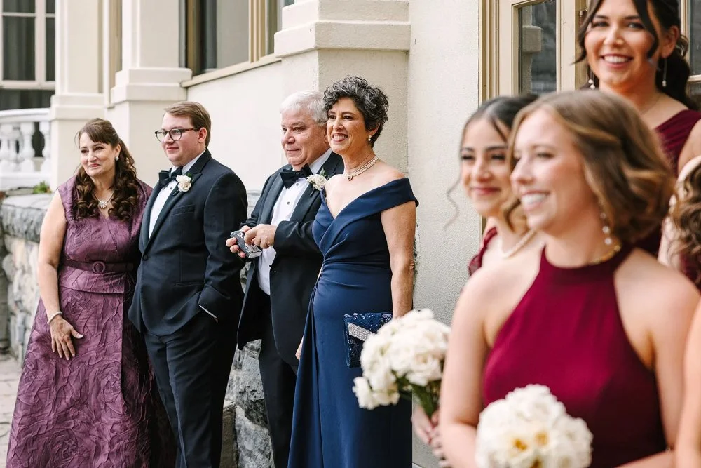 family and friends looking and admiring the couple