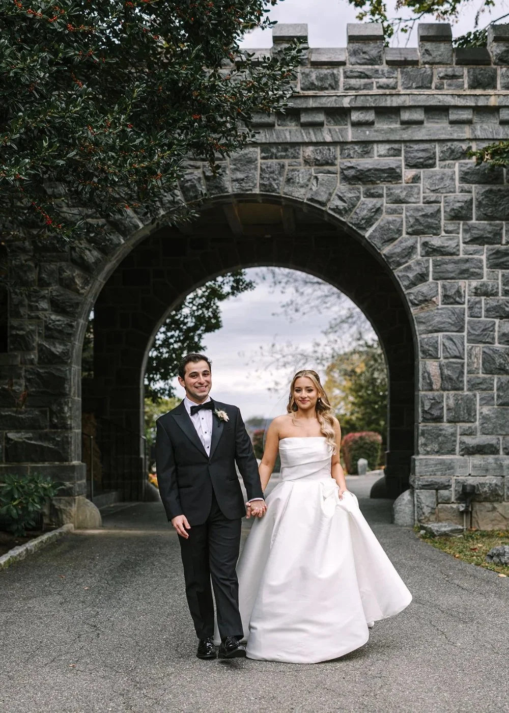 Couple framed by stone archway at a Tarrytown House Estate wedding