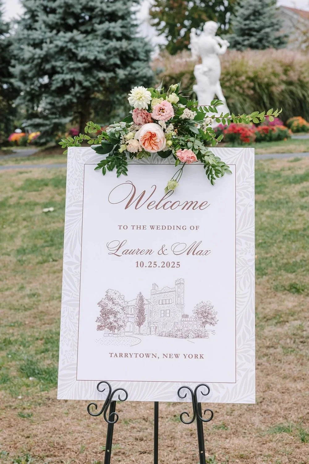 Welcome sign with floral arrangement for Lauren and Max’s wedding in Tarrytown NY