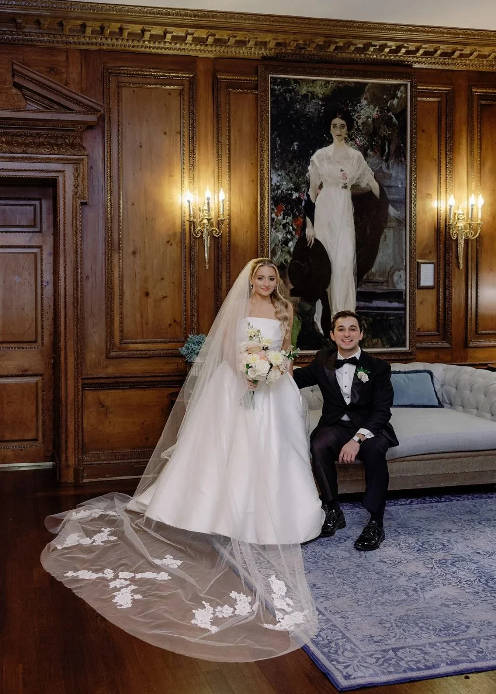 Bride and groom posing in elegant wood-paneled room at a Tarrytown House Estate wedding
