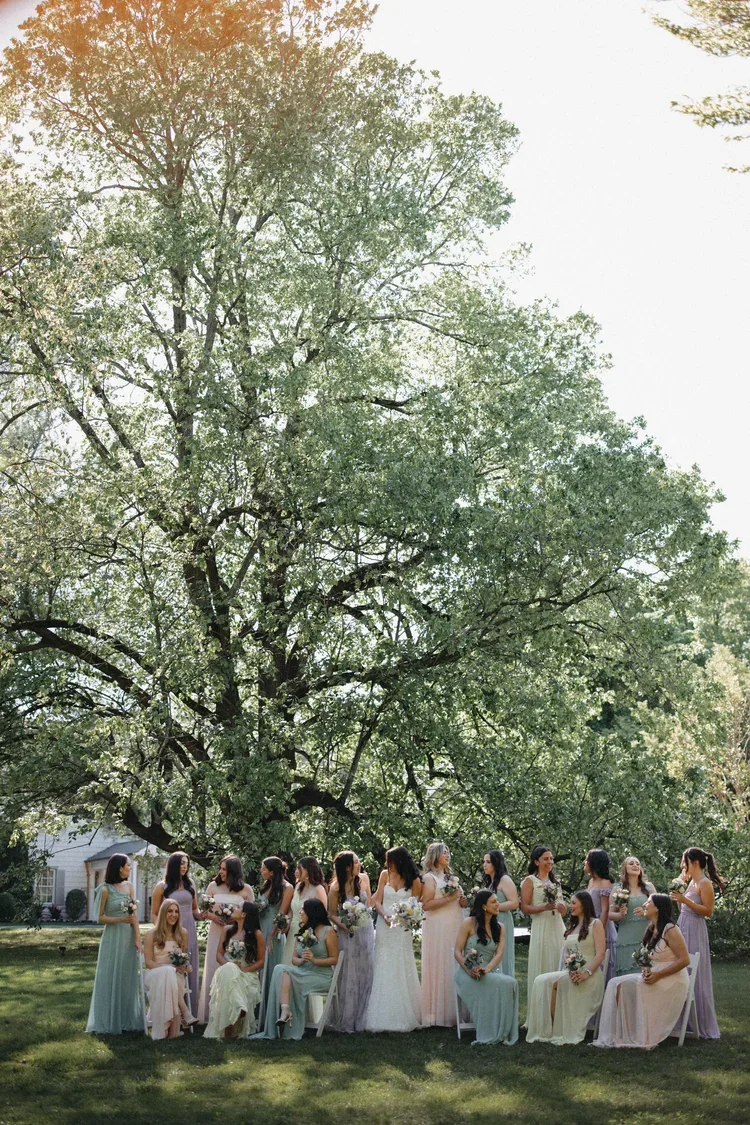 Pastel bridesmaid dresses photographed outdoors during the best month to get married in New York