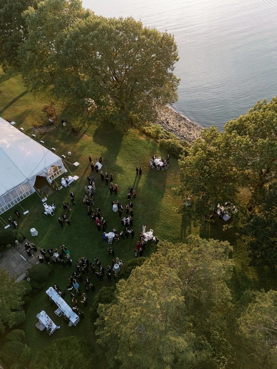 Aerial view of Wainwright House and its waterfront grounds hosting an elegant fall wedding celebration in Rye, New York.
