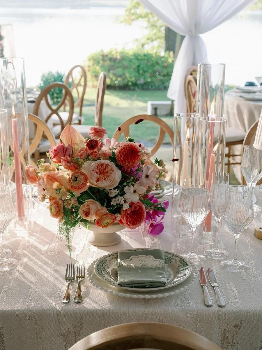 Reception table overlooking the waterfront with romantic floral décor at a Wainwright House wedding.