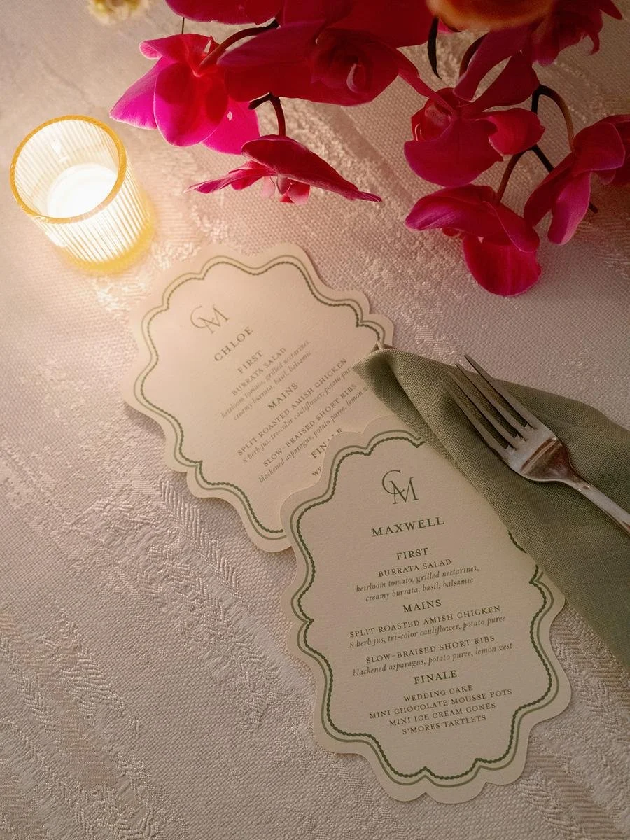 Vintage-inspired wedding menus and elegant place settings displayed during a Wainwright House wedding reception.
