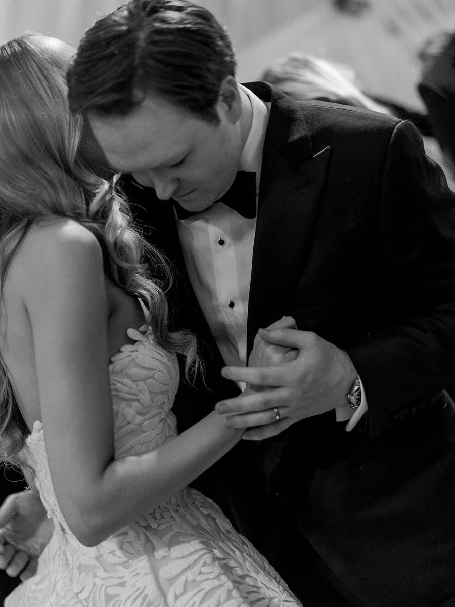 black and white image of bride and groom dancing at New York wedding at Wainwright house