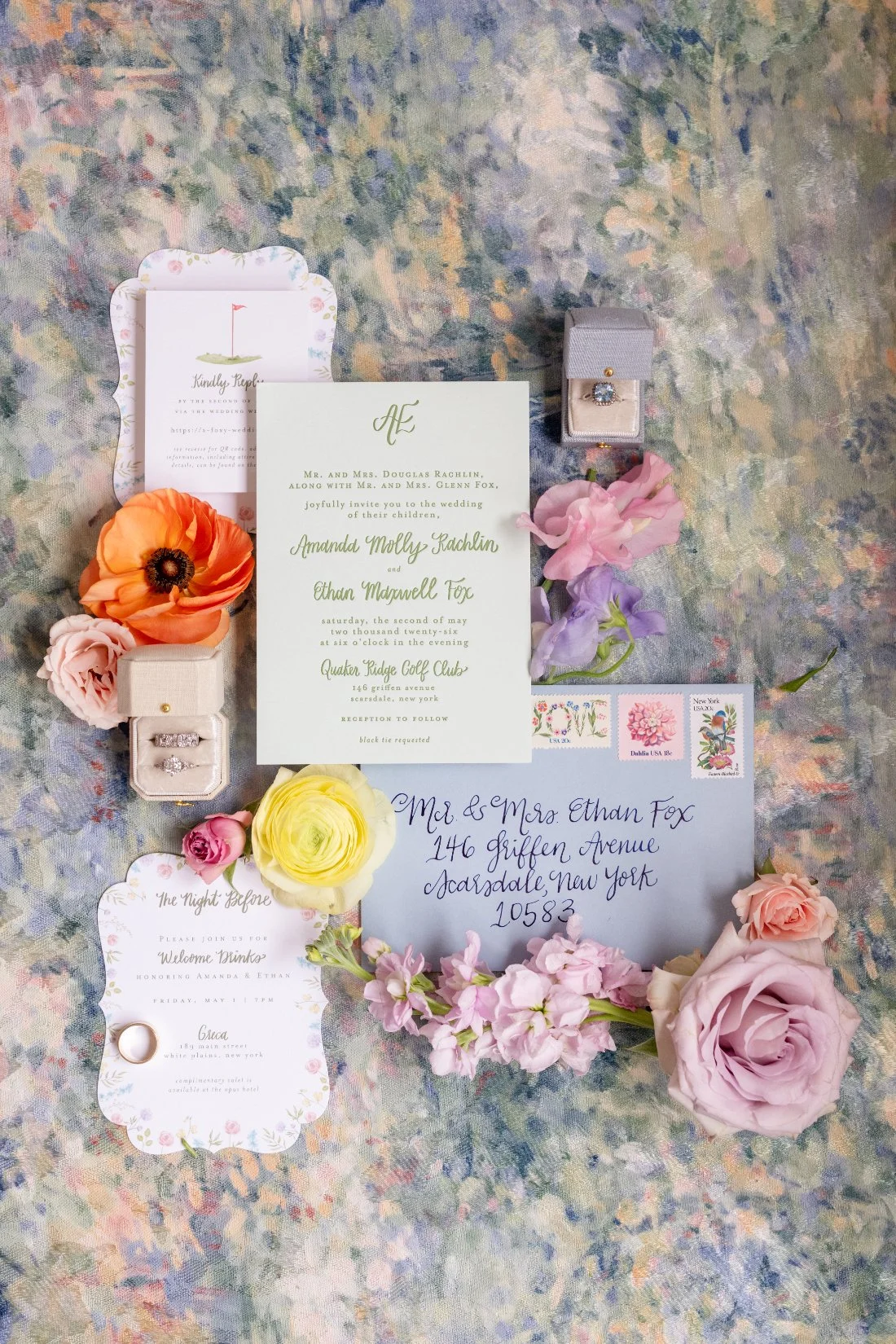 Quaker Ridge Golf Club wedding invitation suite with colorful spring flowers and wedding rings
