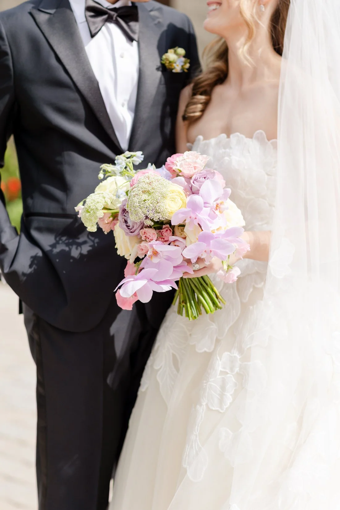 Colorful bridal bouquet during a spring Quaker Ridge Golf Club wedding