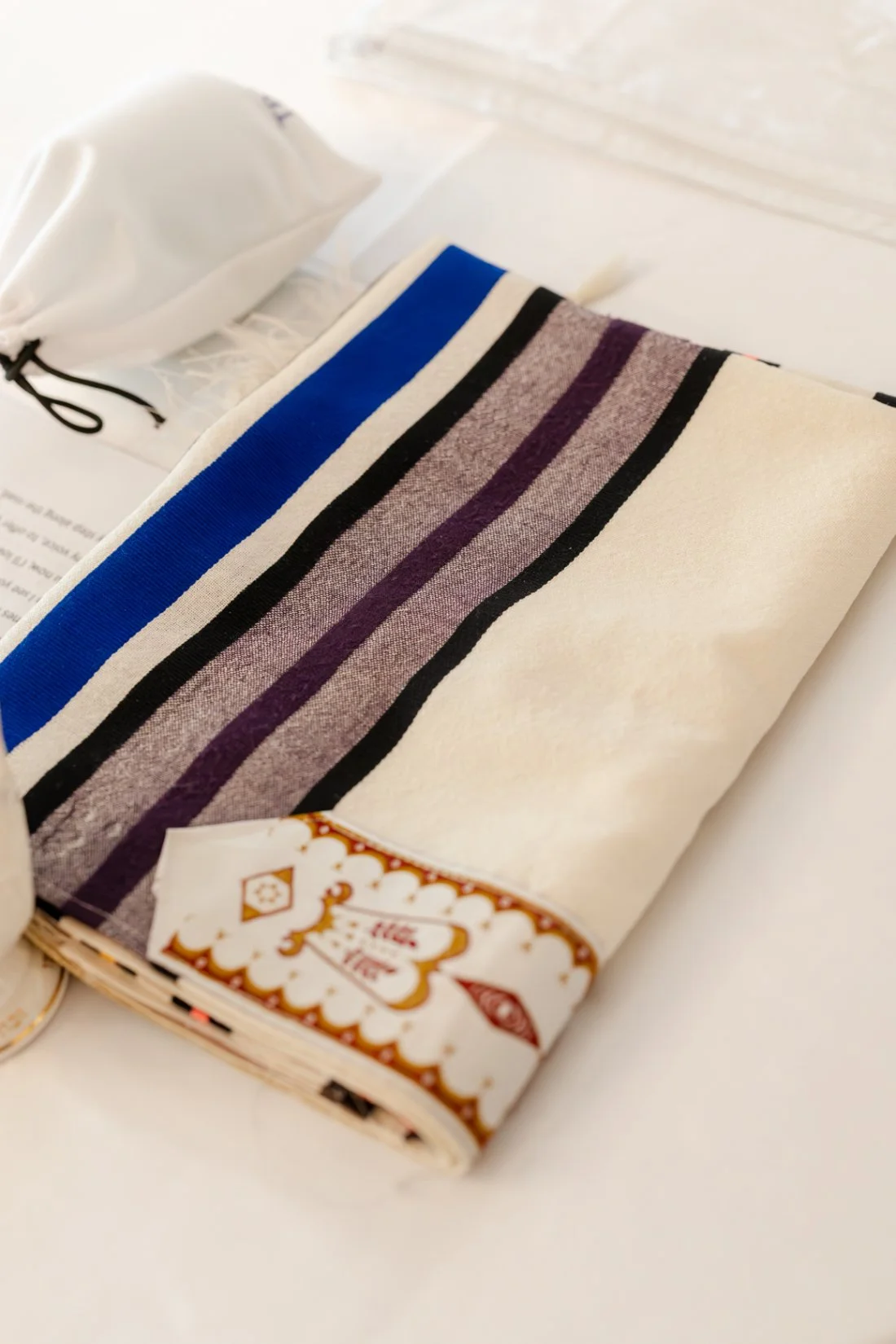 Traditional Jewish prayer shawl prepared for the groom to wear during the wedding ceremony.