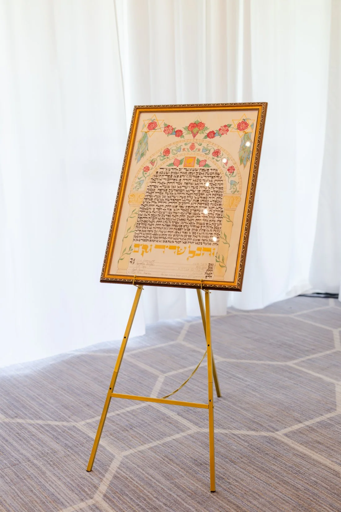 Framed Ketubah displayed as part of the Jewish traditions at a Quaker Ridge Golf Club wedding.