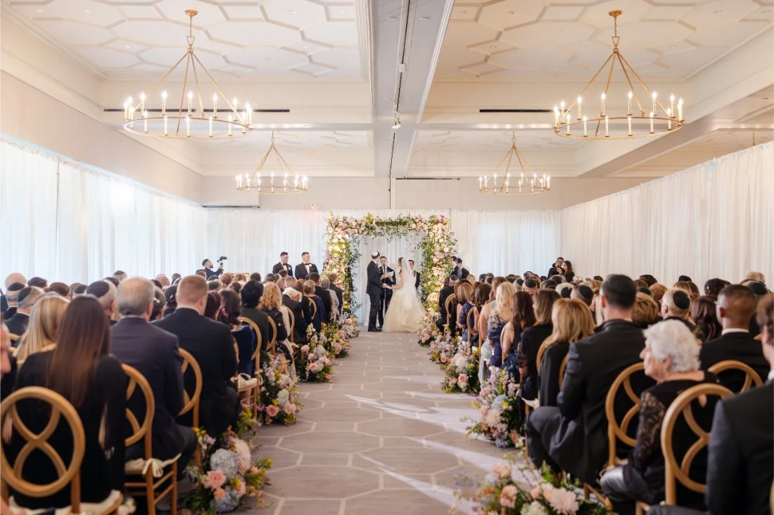 Wide view of the Jewish ceremony at a Quaker Ridge Golf Club wedding.