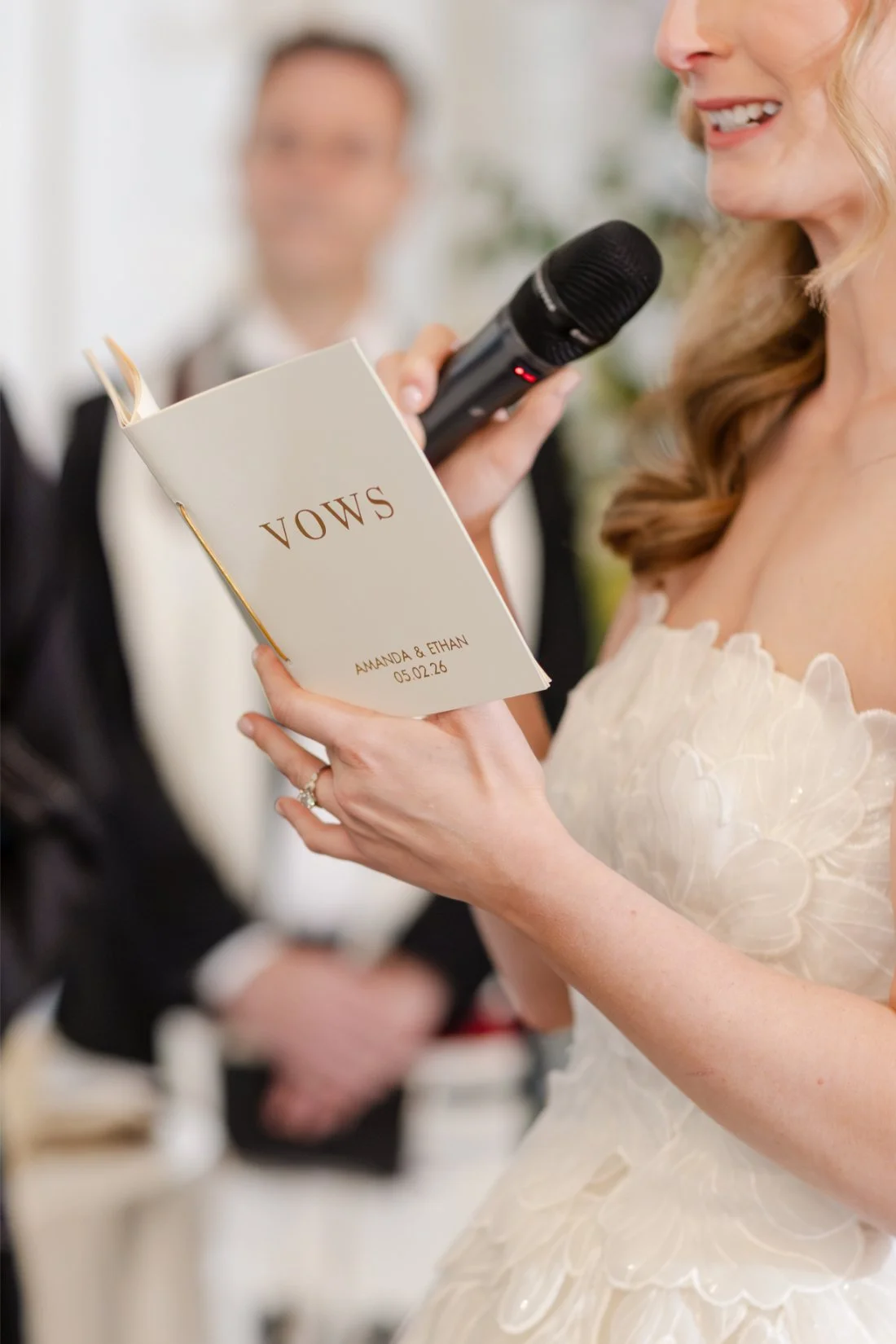 Close-up of the bride holding her vows during the wedding ceremony.