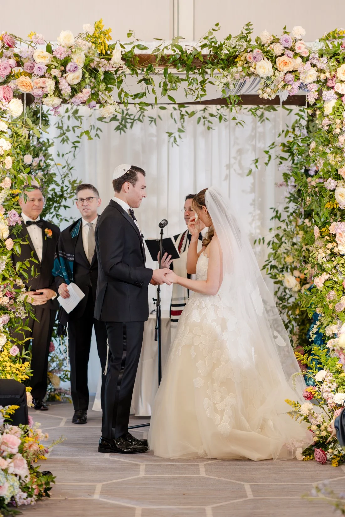 Bride and groom standing together at the altar during their Quaker Ridge Golf Club wedding ceremony.
