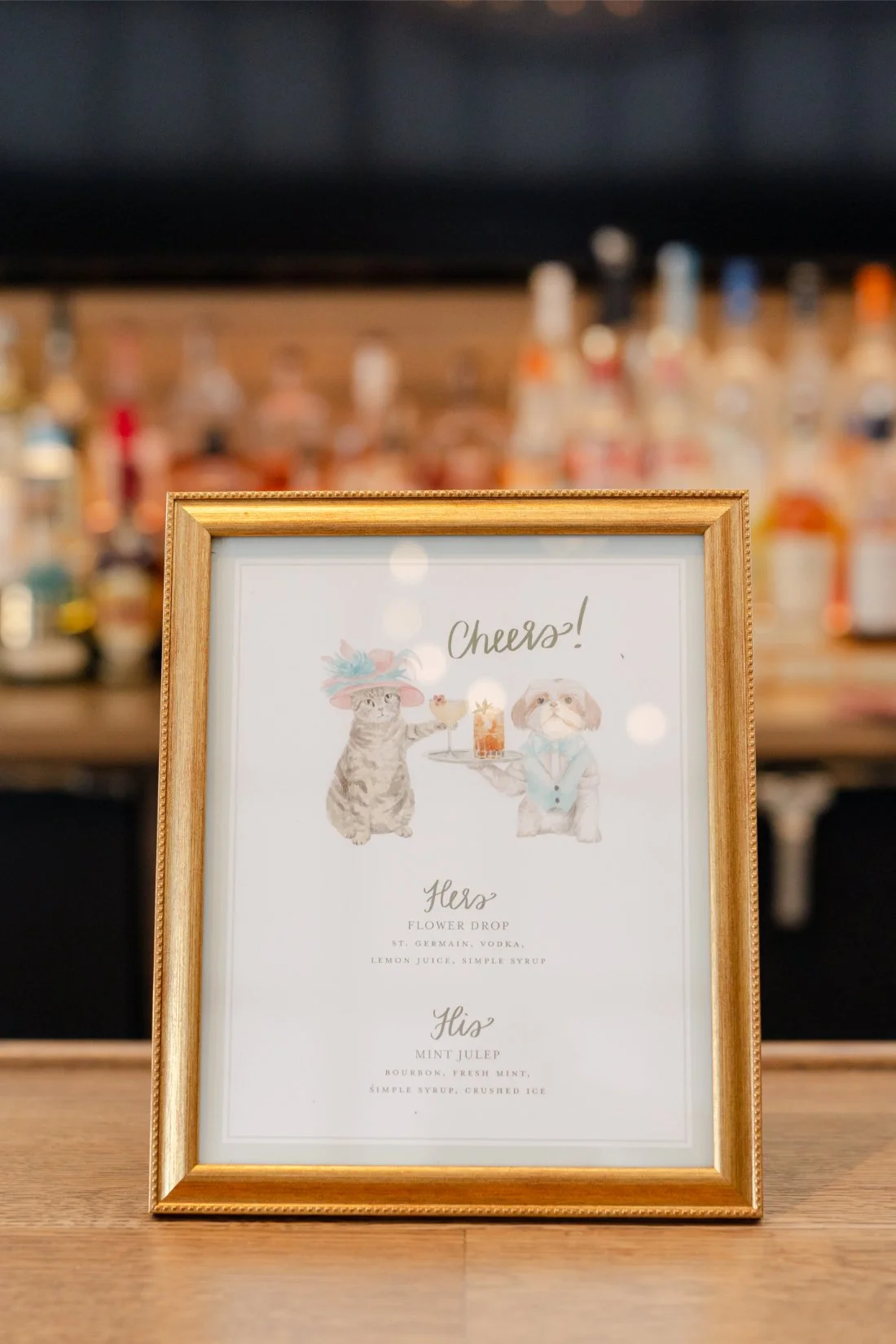 Personalized cocktail menu displayed at a Quaker Ridge Golf Club wedding cocktail hour.