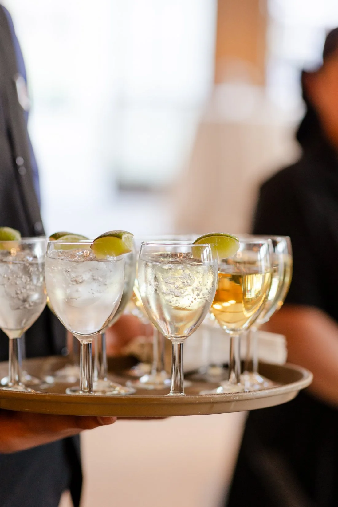 Drinks being served to guests during a Quaker Ridge Golf Club wedding cocktail hour.