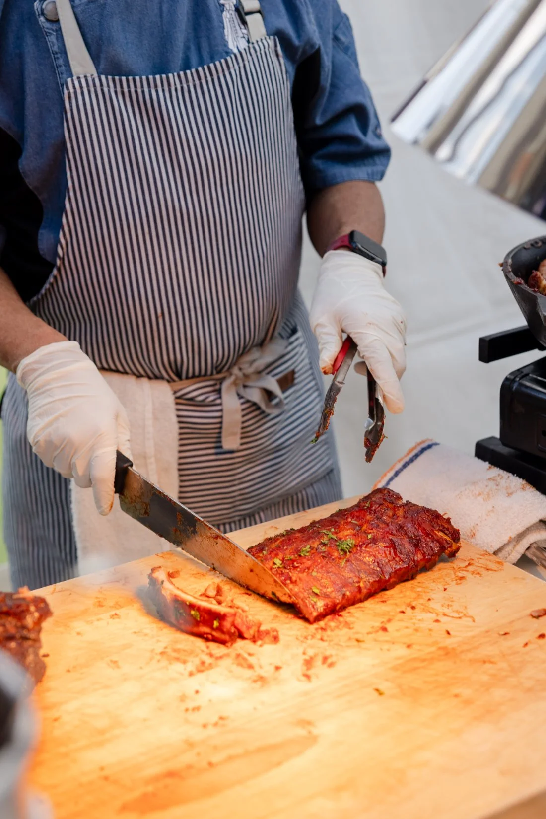 Caterer serving a passed appetizer at a Quaker Ridge Golf Club wedding.