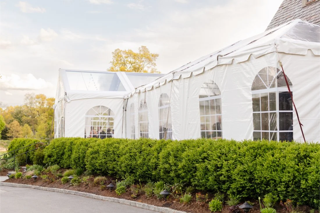 Exterior view of the wedding tent set up outside the venue.