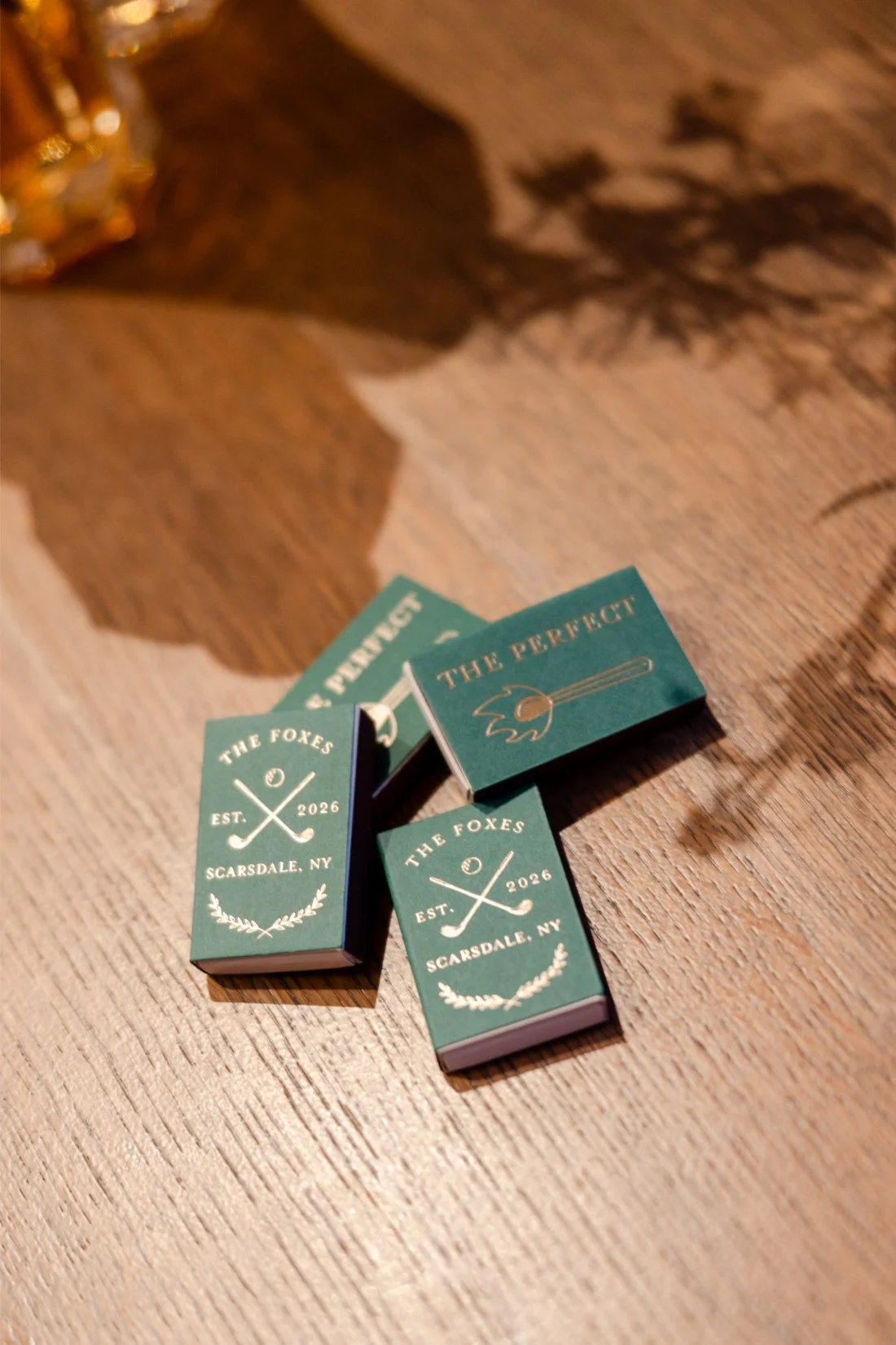 Personalized matchboxes displayed as a wedding detail for guests.