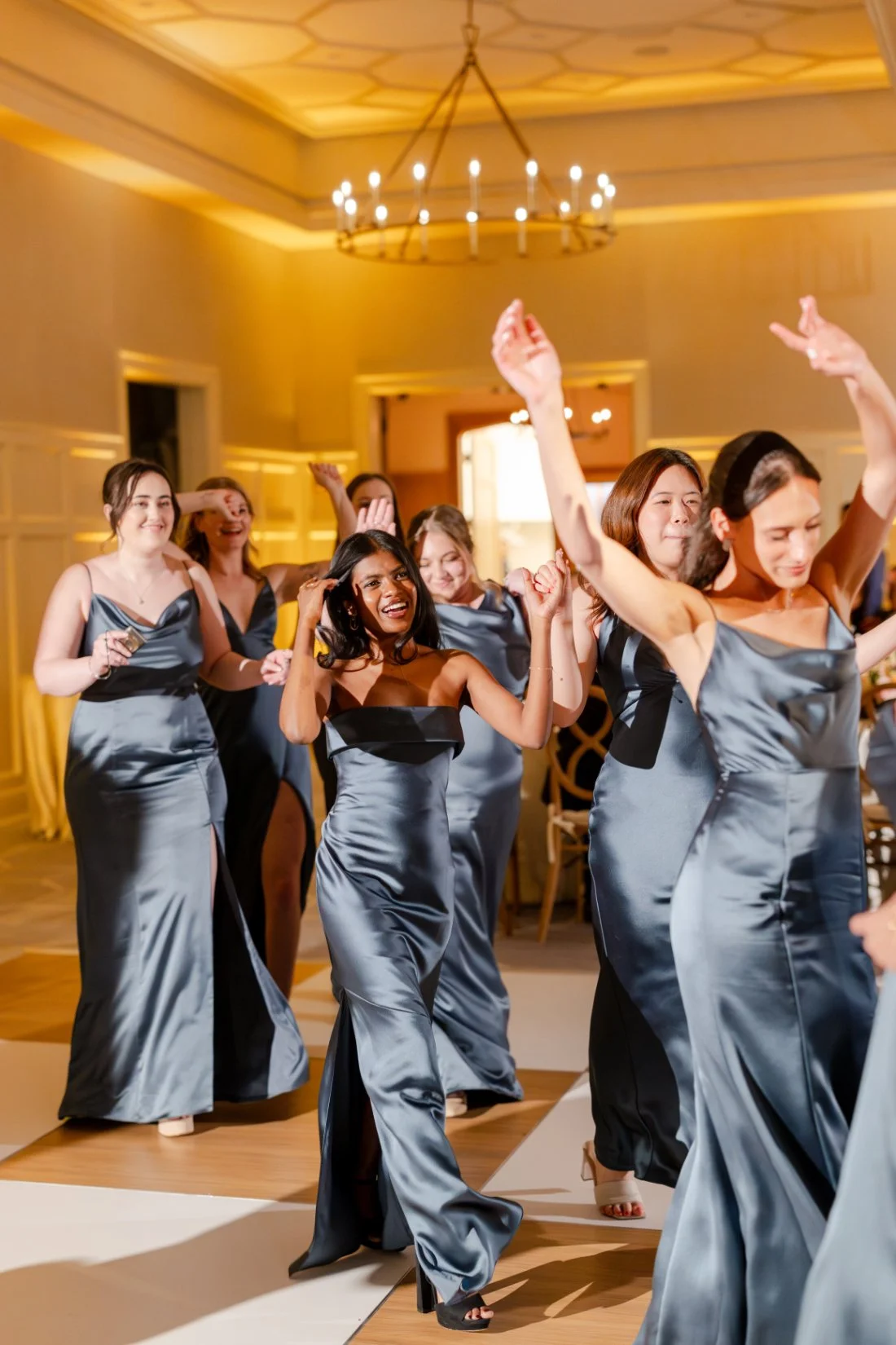 Bridal party making their entrance into the Quaker Ridge Golf Club wedding reception.