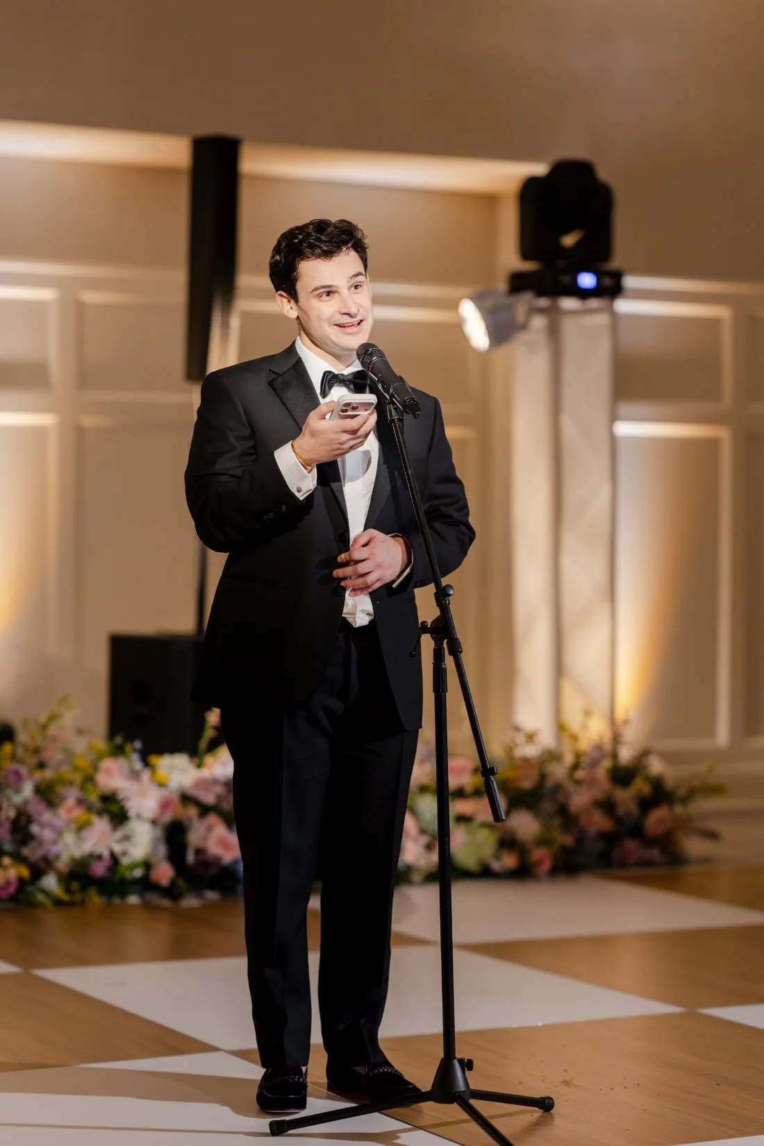 Guest giving a speech during the Quaker Ridge Golf Club wedding reception.