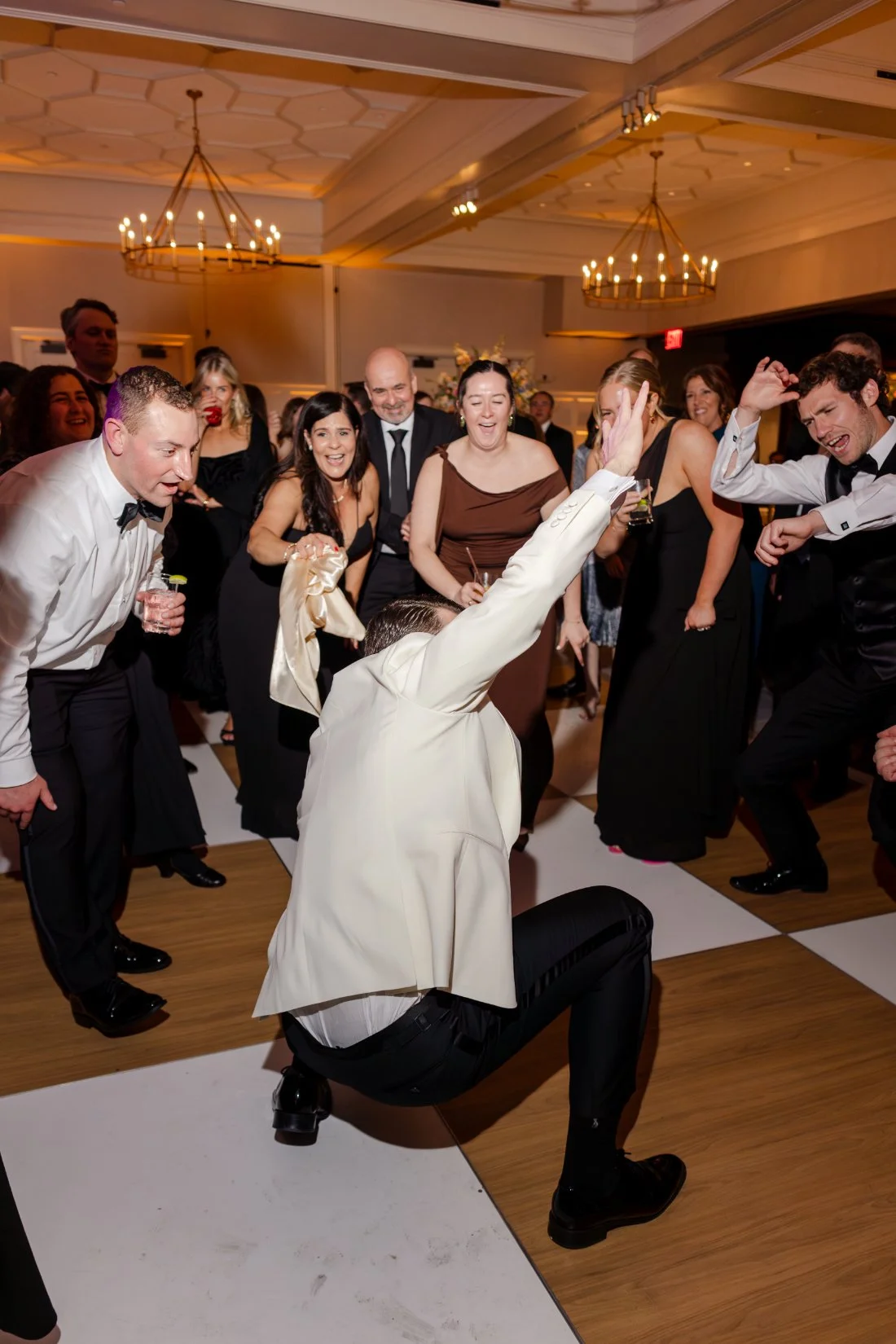 Wedding guest dancing and enjoying the reception celebration.