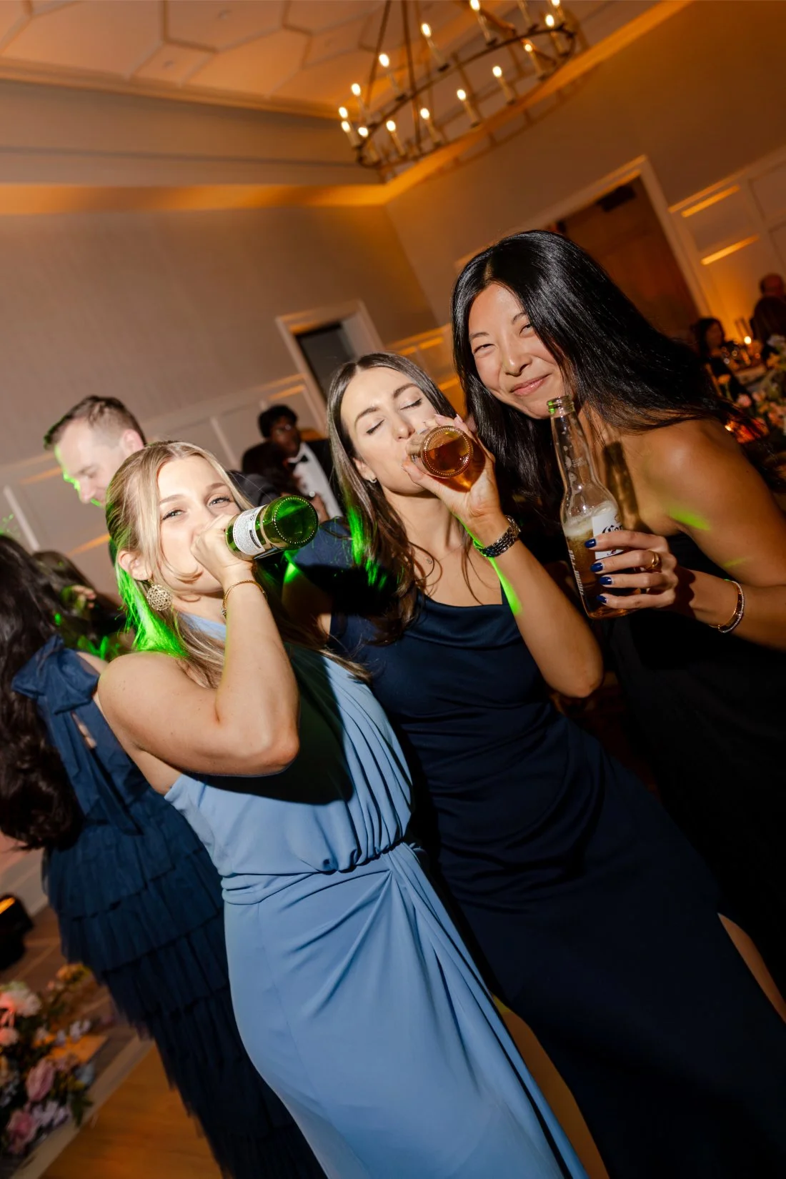Guests enjoying drinks together during the wedding reception.
