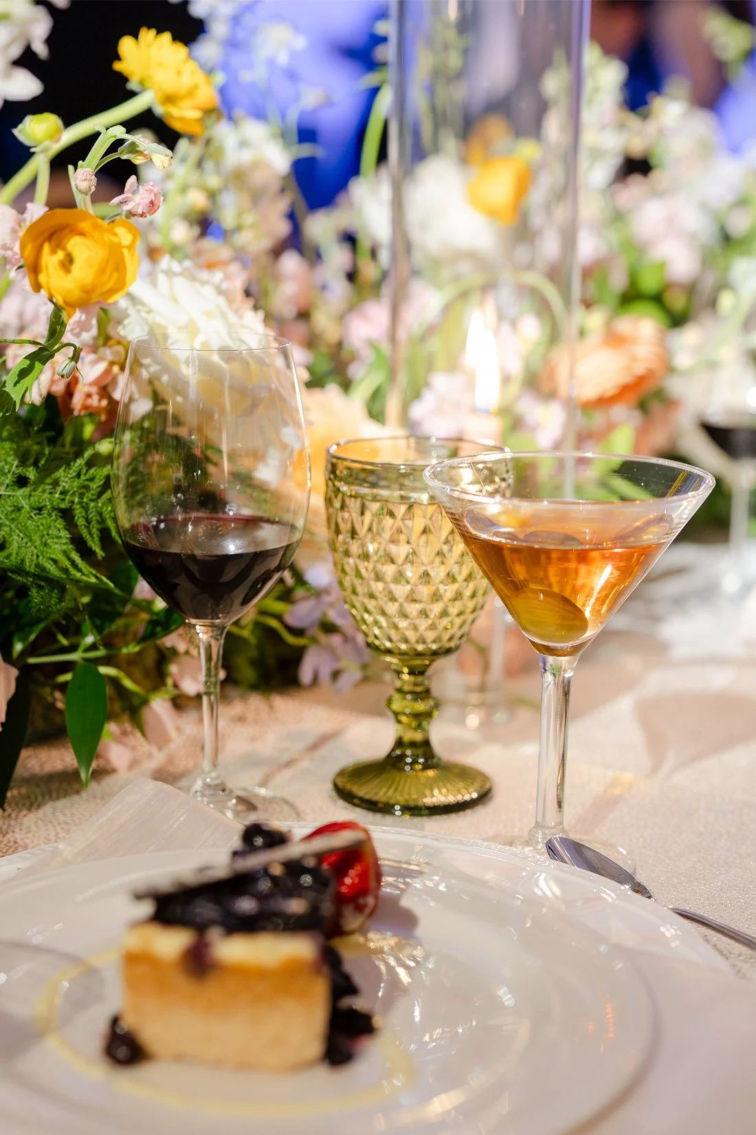 Wedding cake and wine displayed on a table at the Quaker Ridge Golf Club wedding.