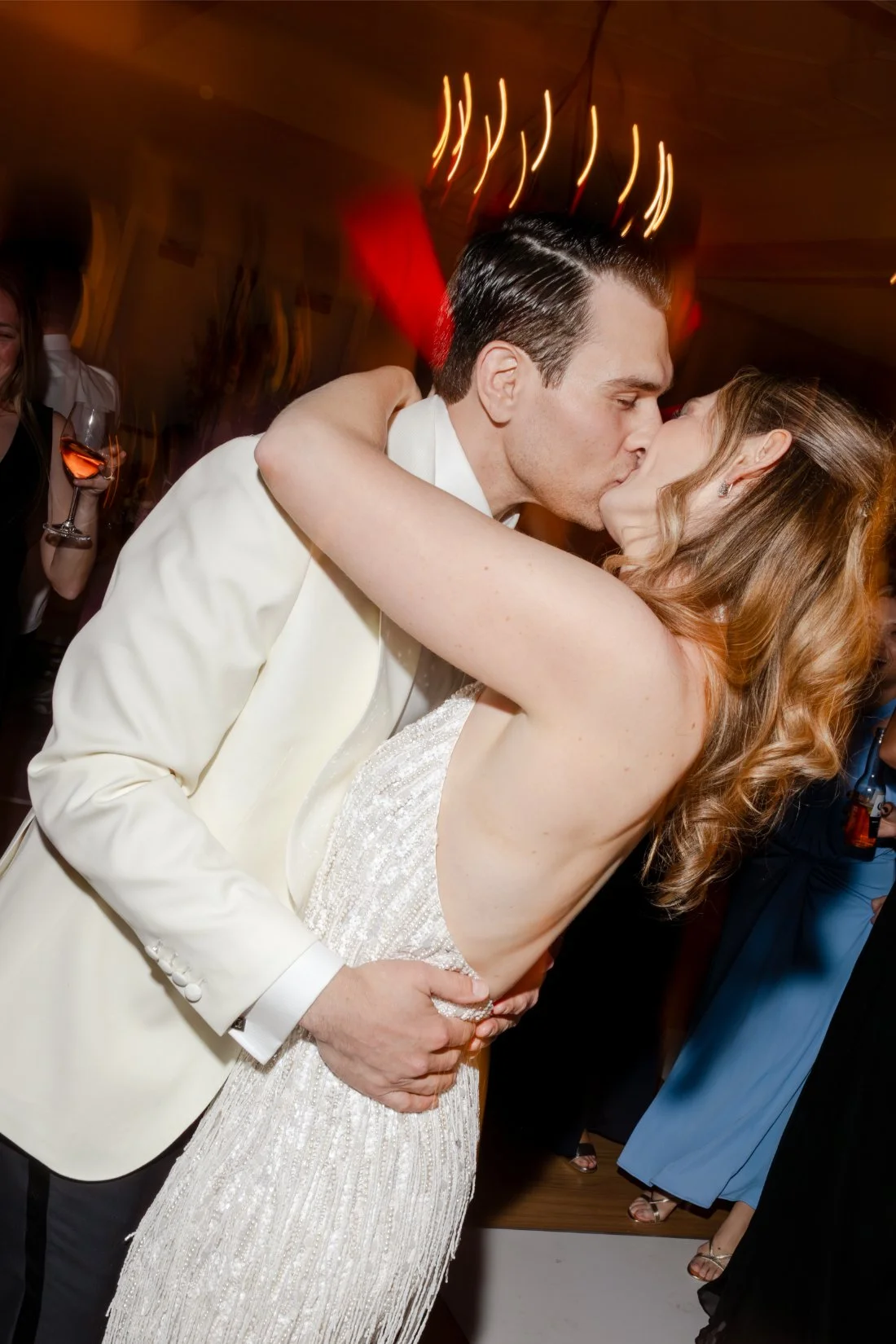 Bride and groom sharing a kiss during their Quaker Ridge Golf Club wedding reception.