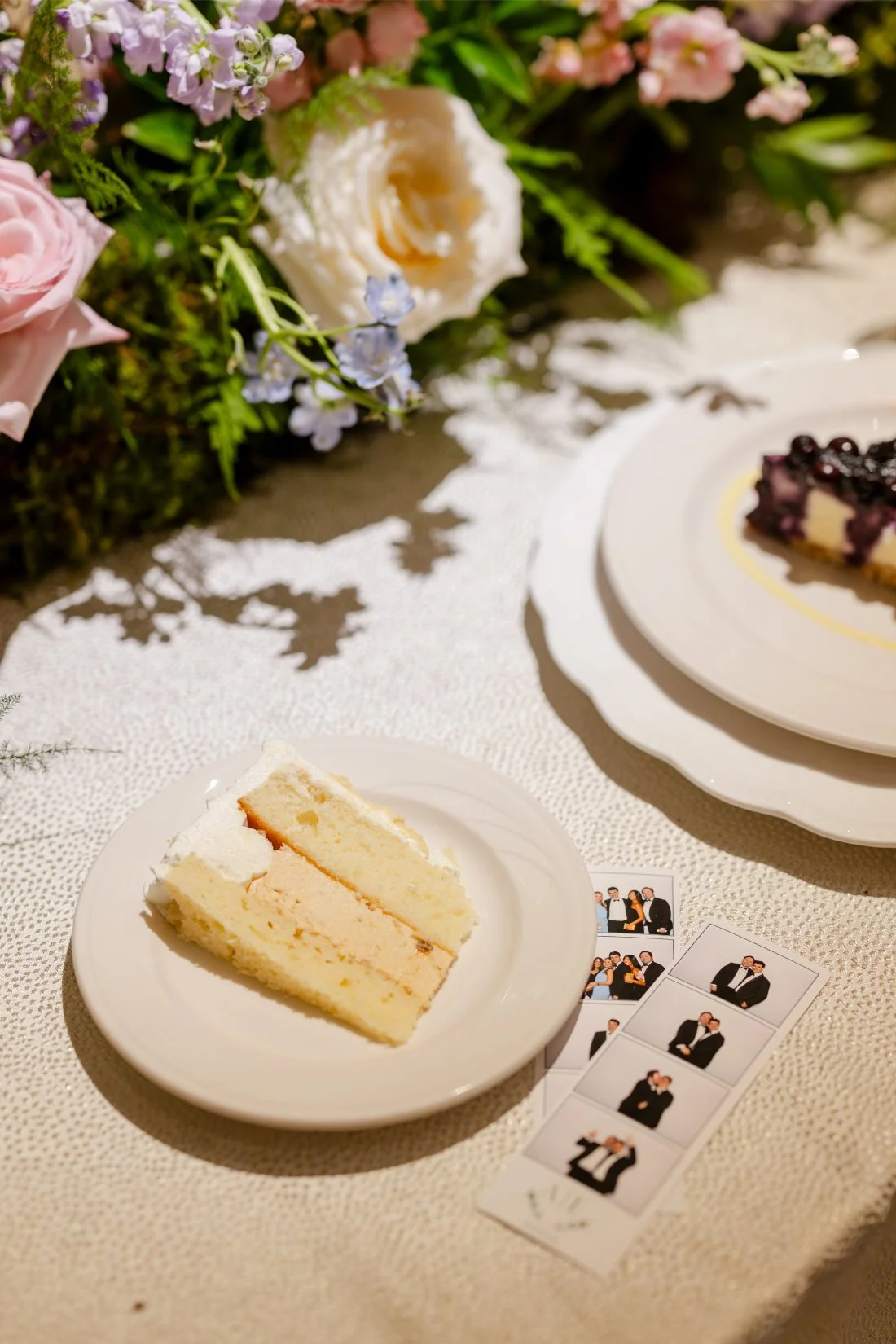 Colorful wedding cake displayed on the table at the Quaker Ridge Golf Club wedding reception.