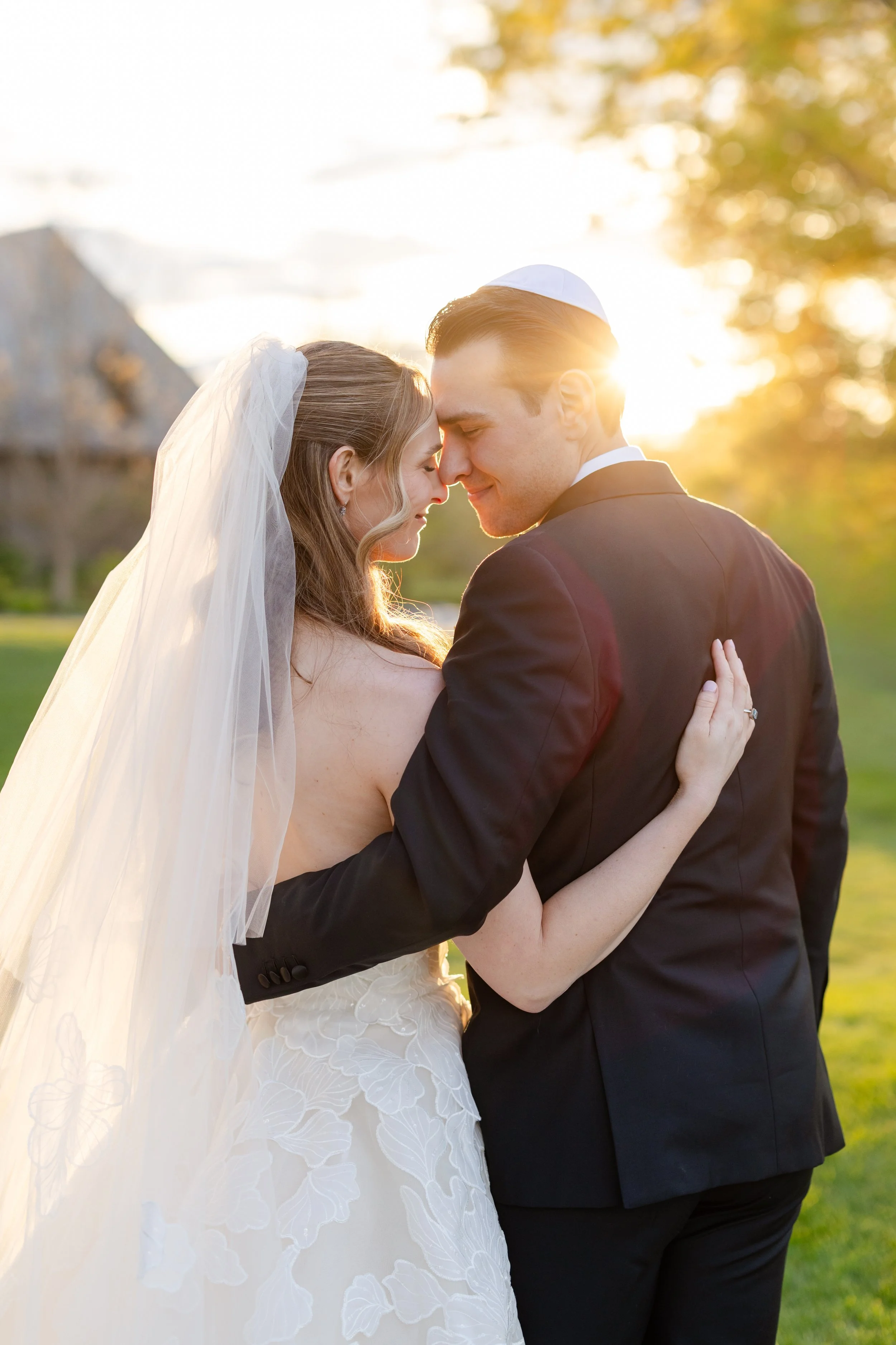 Bride and groom enjoying sunset portraits during their Quaker Ridge Golf Club wedding.