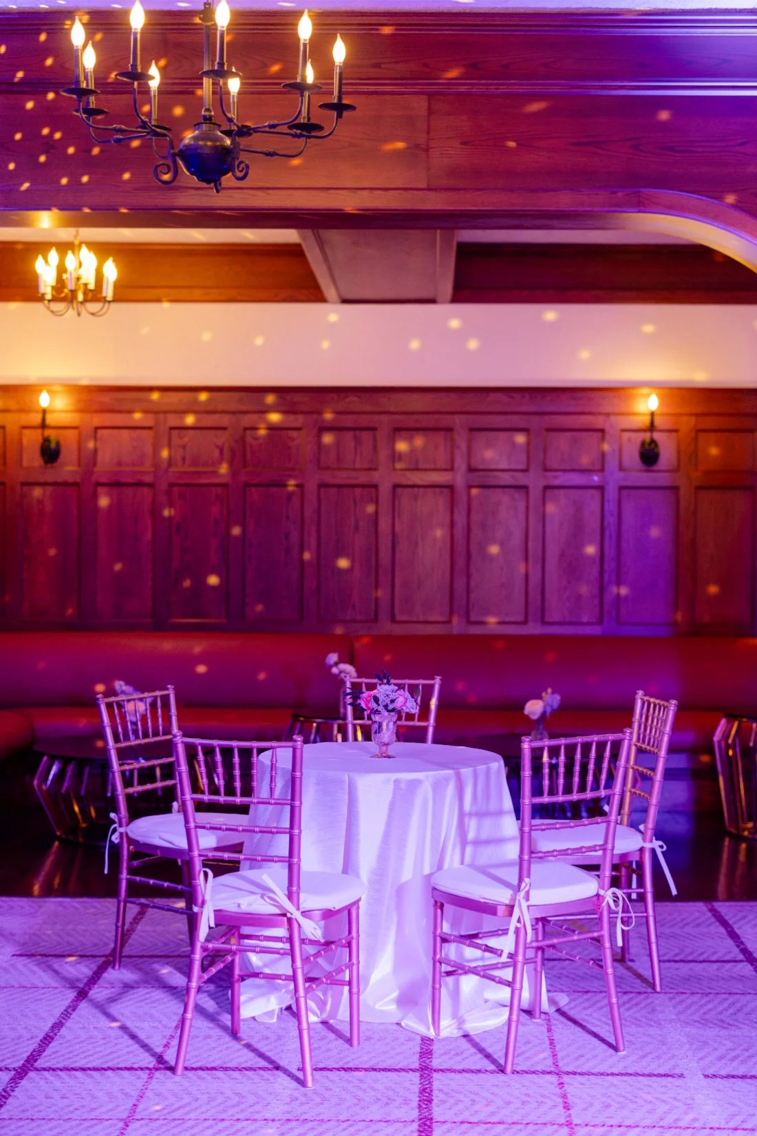 Lounge seating with colorful party lighting at the Quaker Ridge Golf Club wedding.