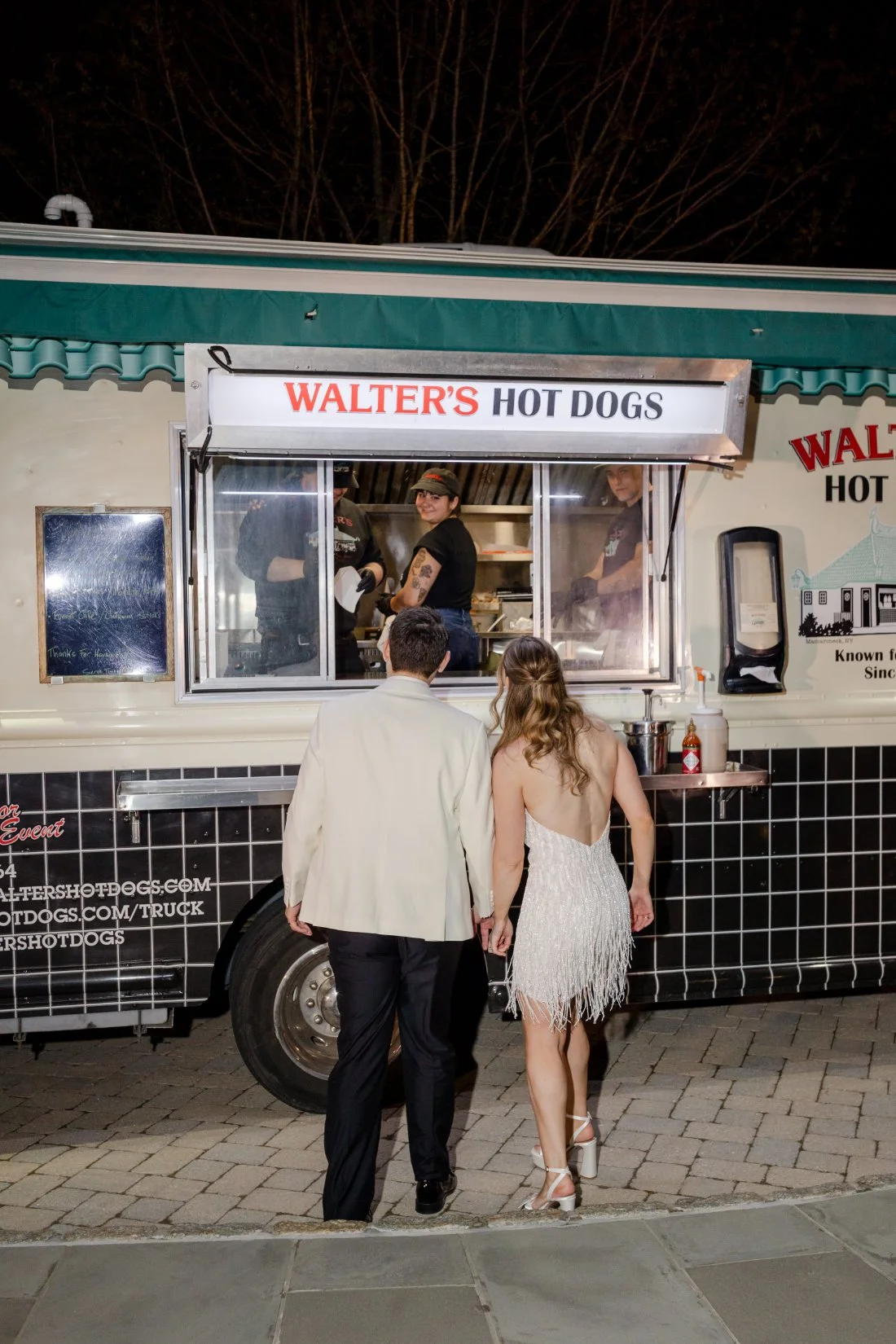 Amanda and Ethan visiting the Walter’s Hot Dogs truck during their Quaker Ridge Golf Club wedding after-party.